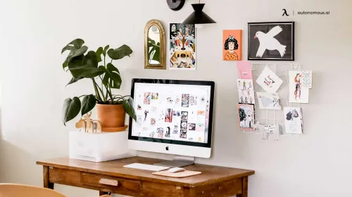 A workspace with personalized elements, such as artwork and photographs